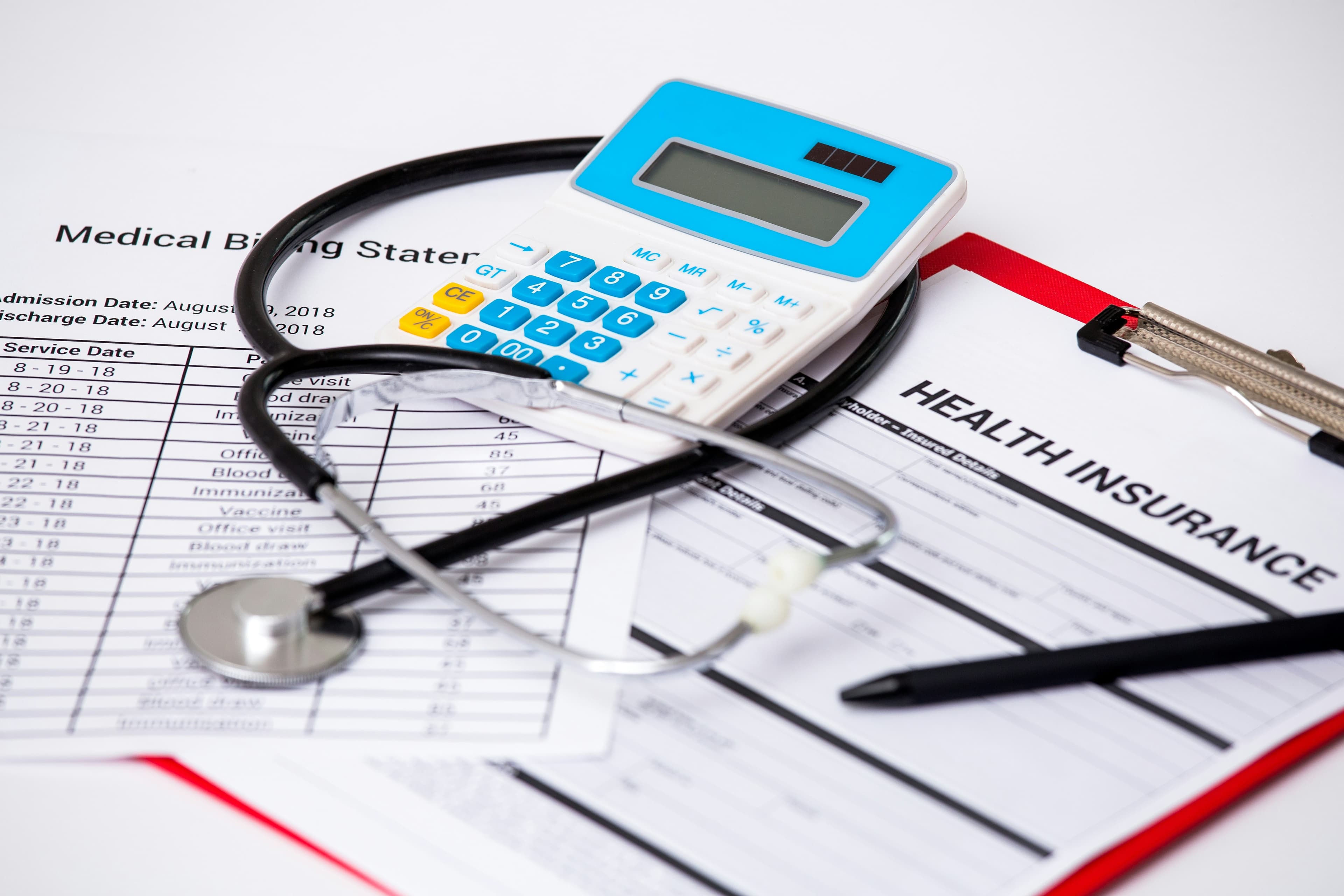 Health insurance paperwork and a stethoscope, representing coverage questions for therapeutic plasma exchange